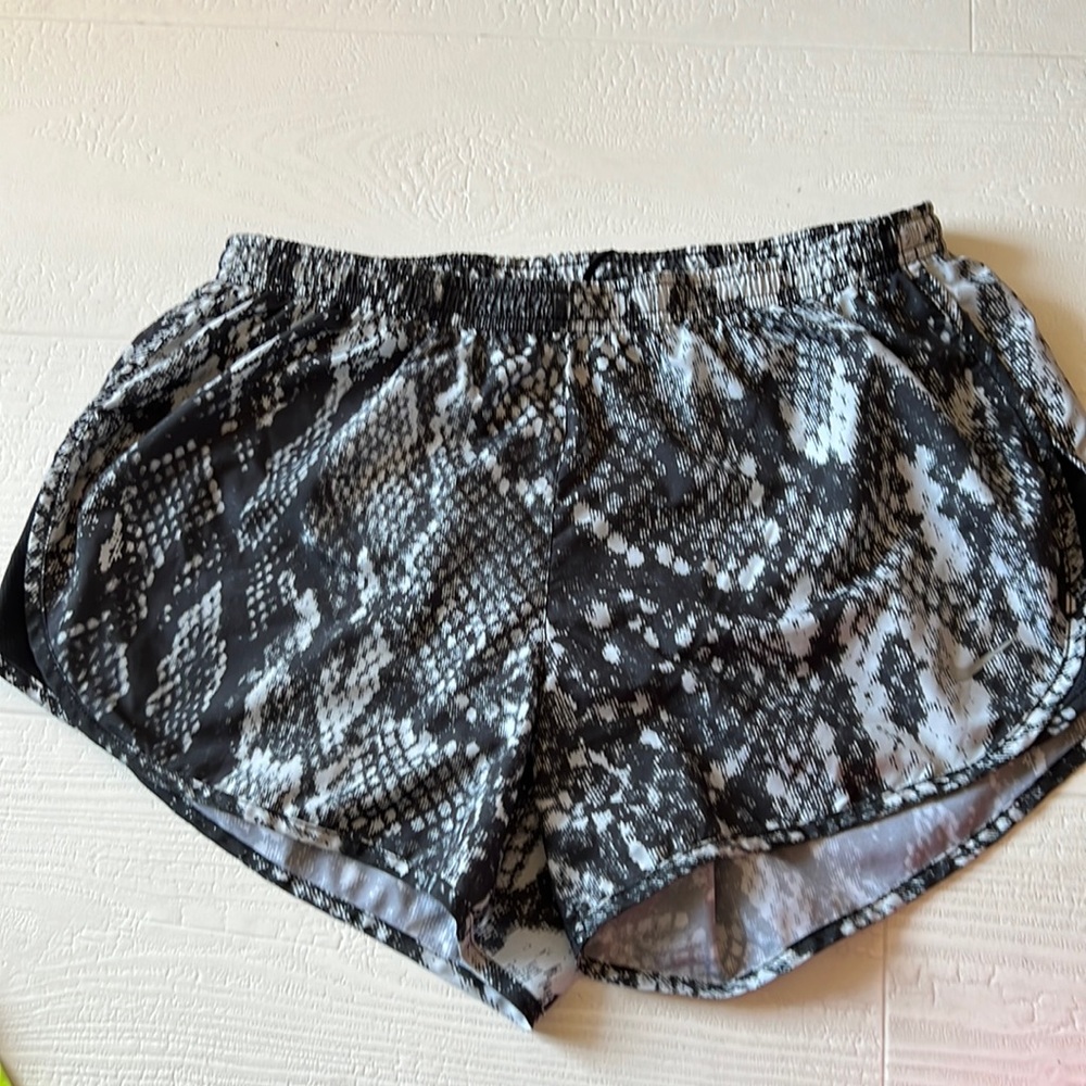 Dry-Fit  Nike shorts, Zipper pocket on back side and one in her pocket backside